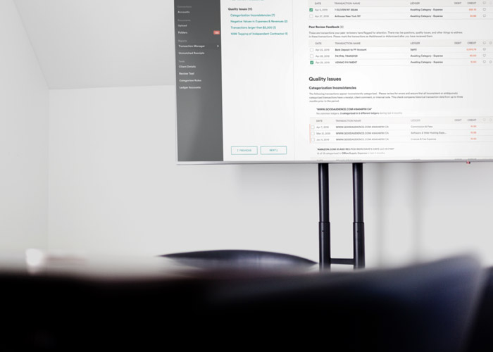 Dense transaction UI projected on a boardroom TV